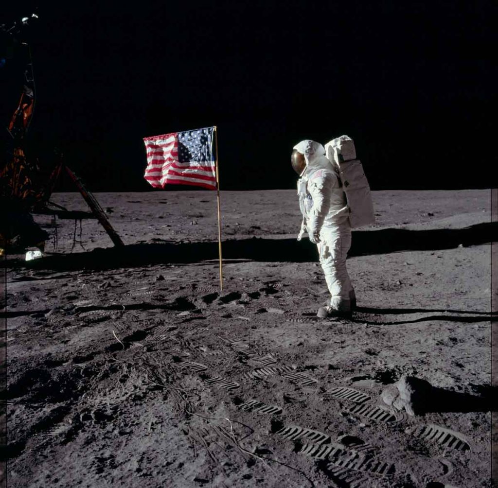 Buzz Aldrin salute the US flag